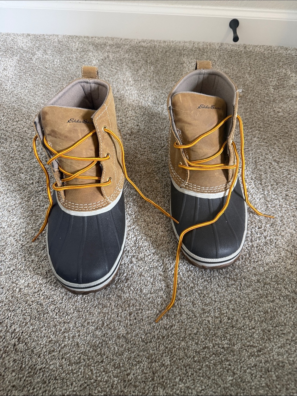 Eddie Bauer women’s  Waterproof Duck Boots in Black and Tan with Yellow Laces